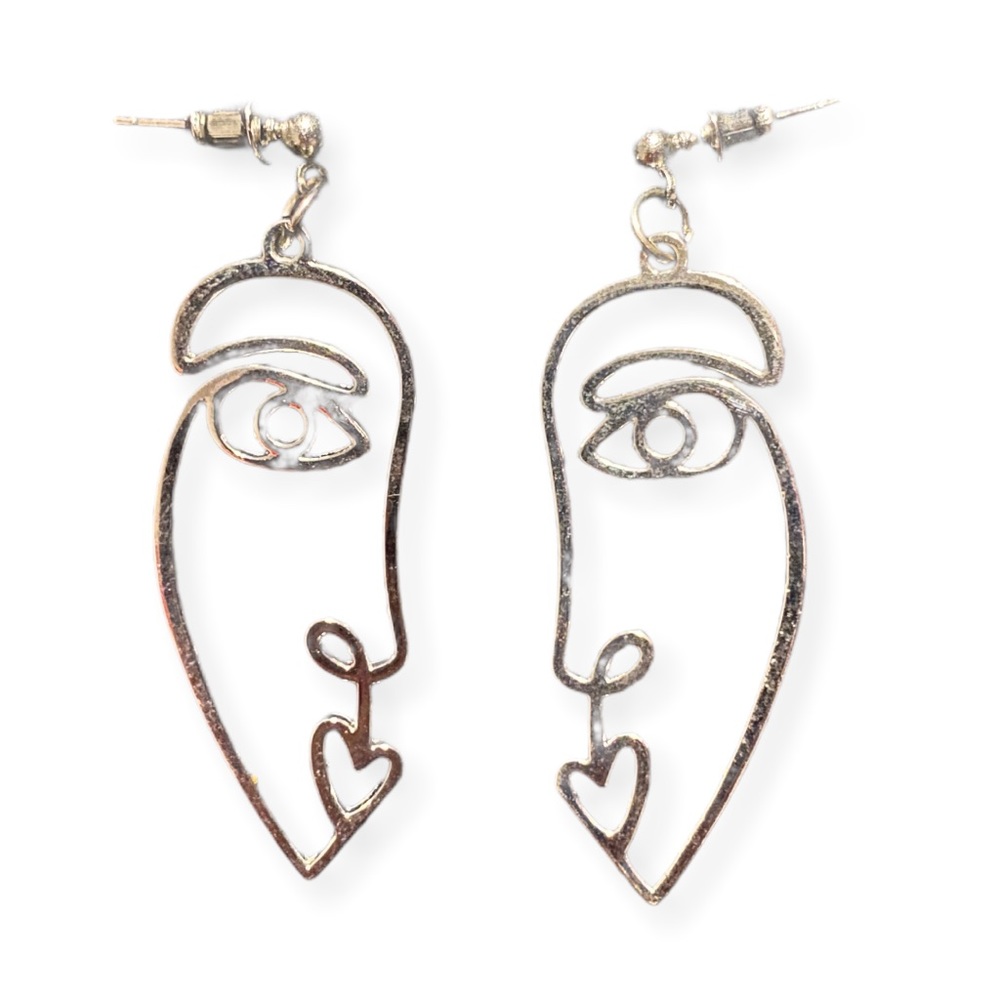 silver avant-garde face earrings